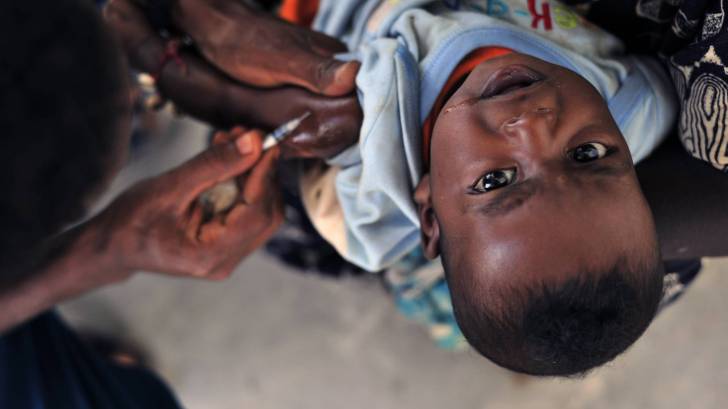 young child getting vaccine