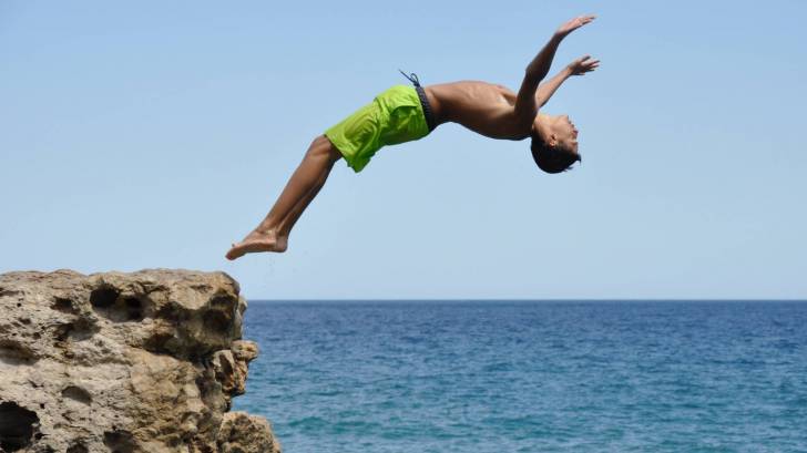 kid diving into water