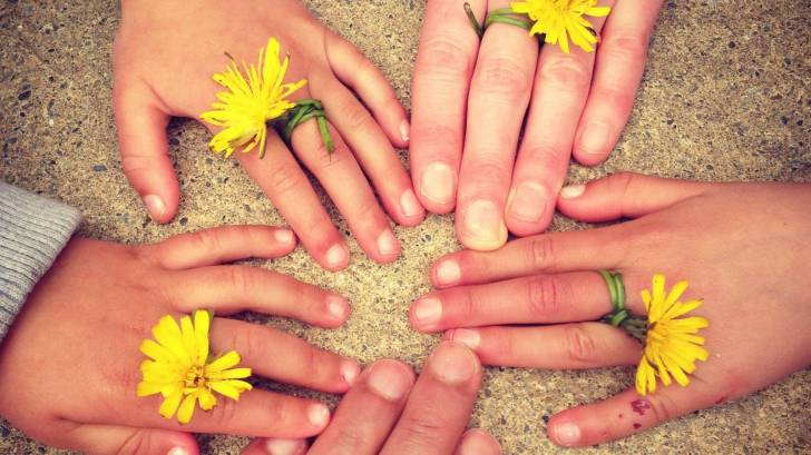 family hand touching each other keeping healthy