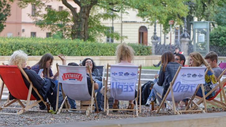 People meeting in a group on a lawn