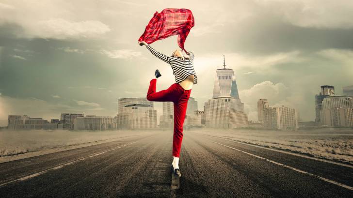 happy girl dancing in the street