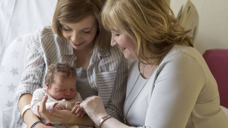 new born, mom and grandma