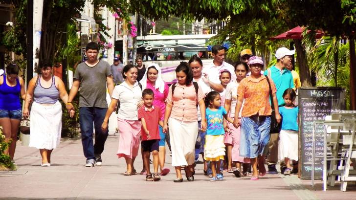 latino large extended family walking together