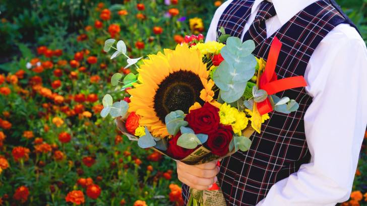 english school child holding flowers