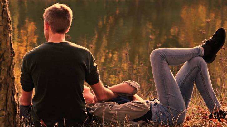 couple laying in the grass