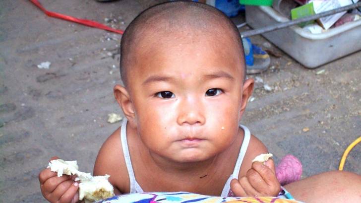 young chinese girl looking at camera