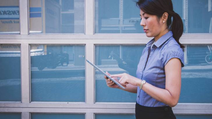 business woman working on pad