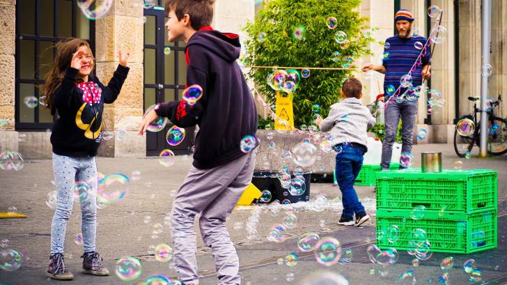 kids playing with bubbles