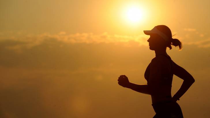 woman running in the sunset