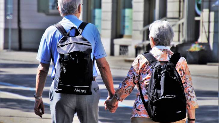 seniors taking a walk hand in hand