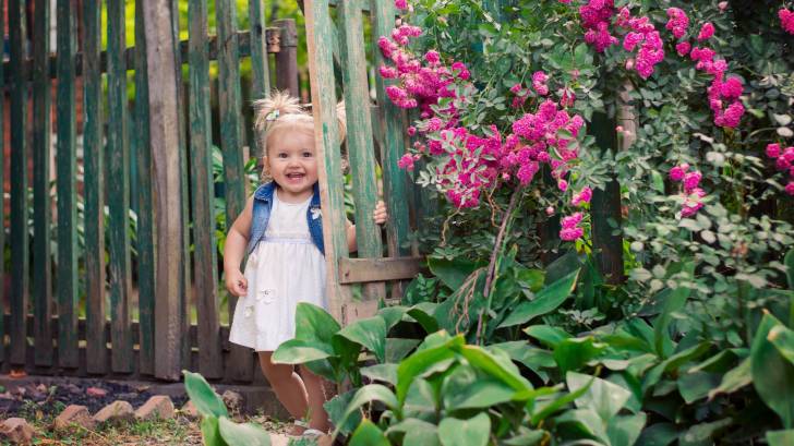 little girl in a garden