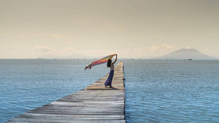 woman on a pier over water