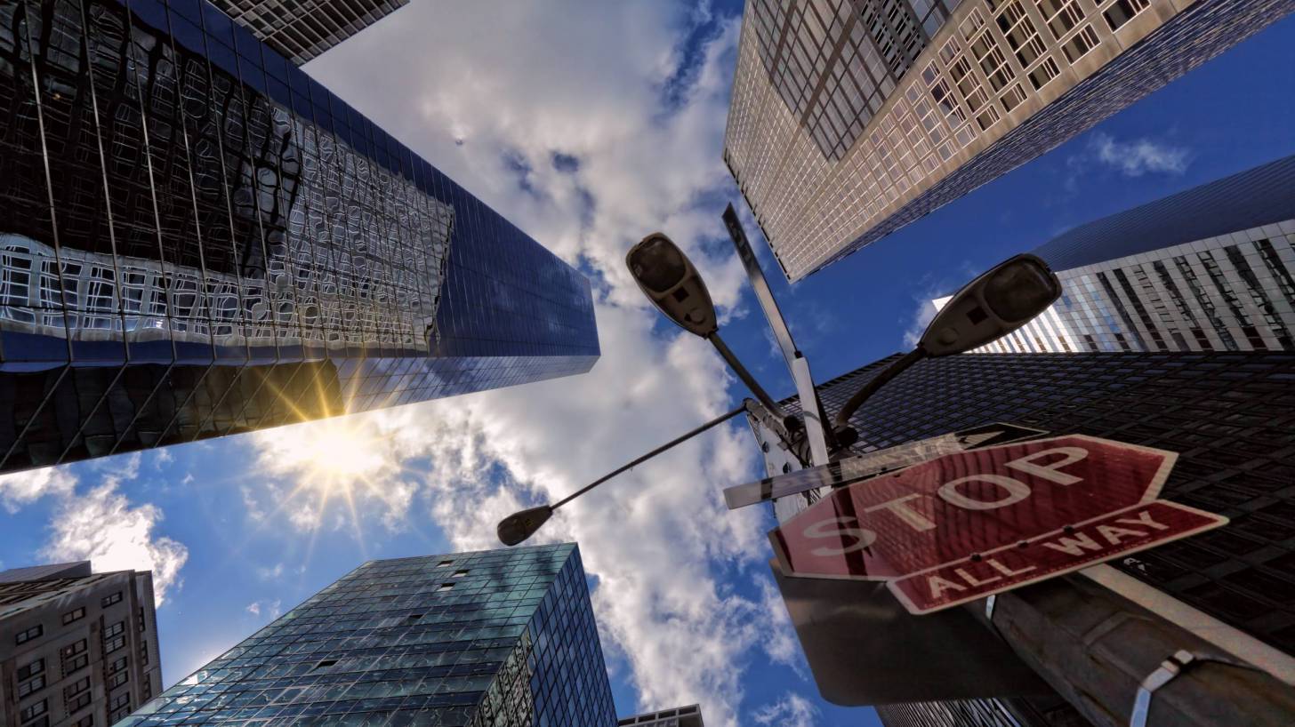 city scape with stop sign