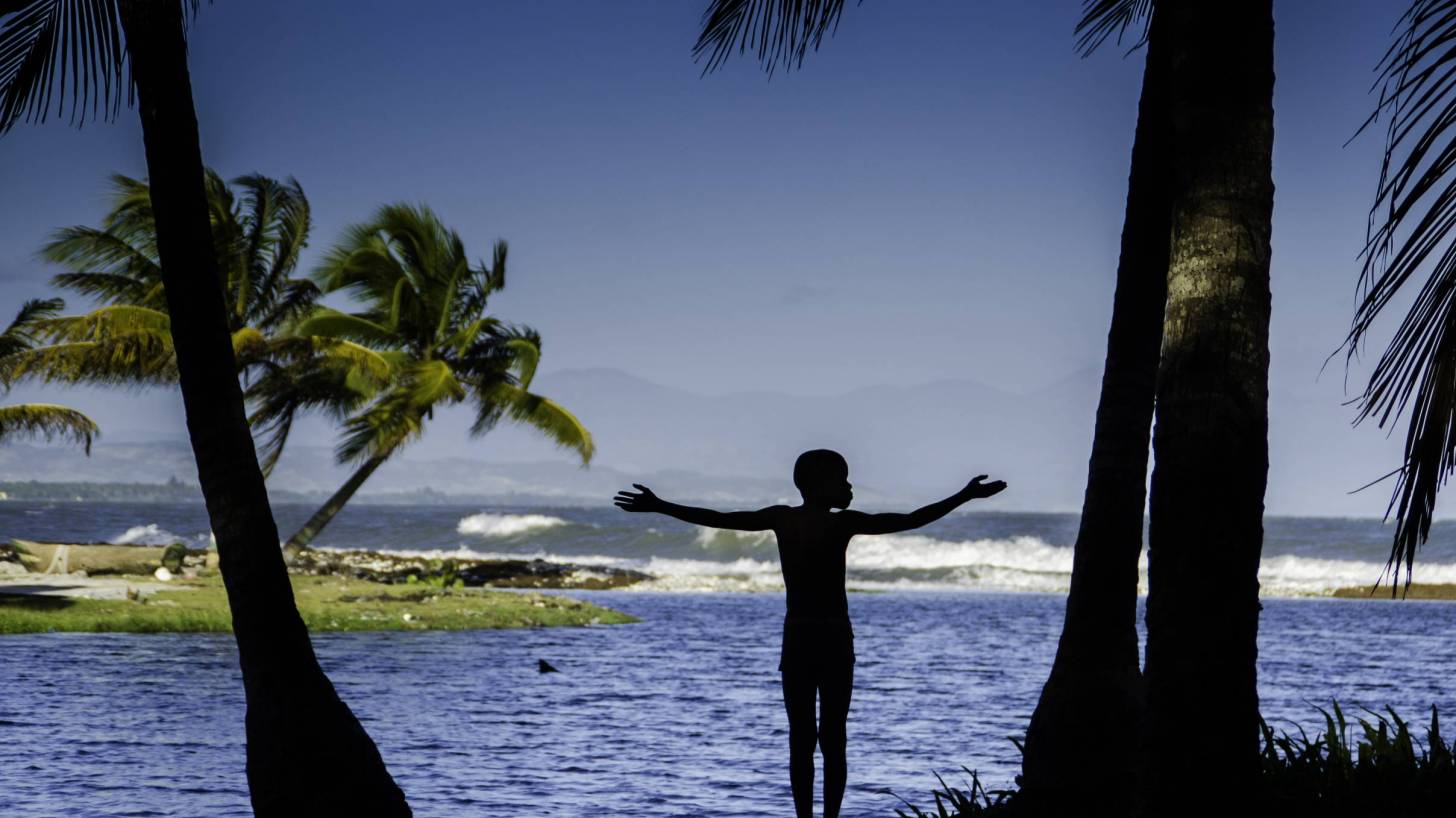 young boy looking over the water