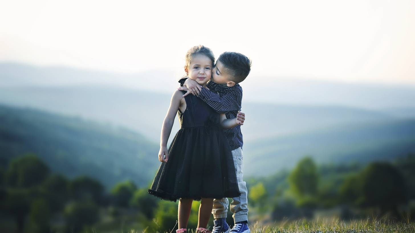 children hugging each other.