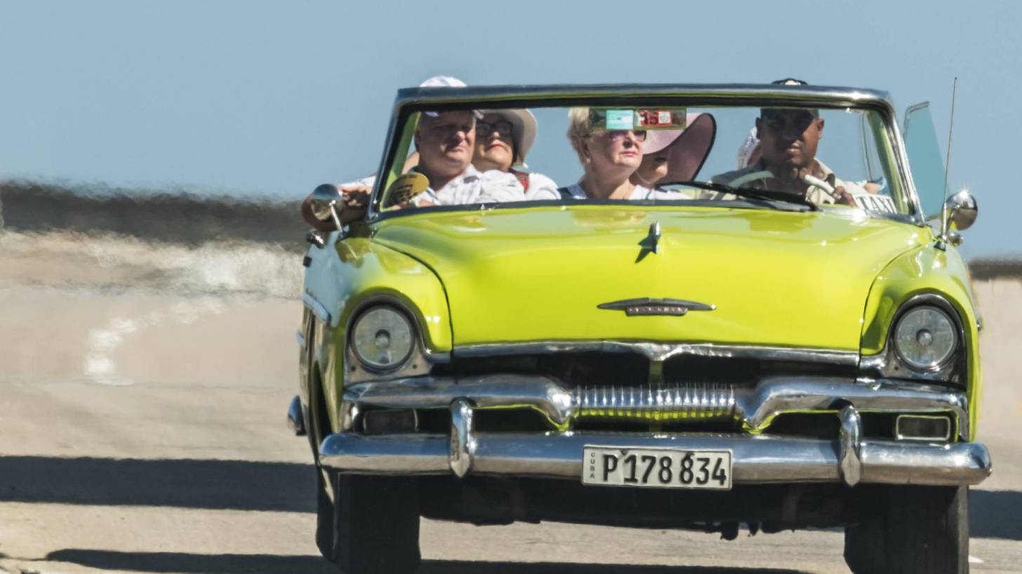 older friends in convertable car