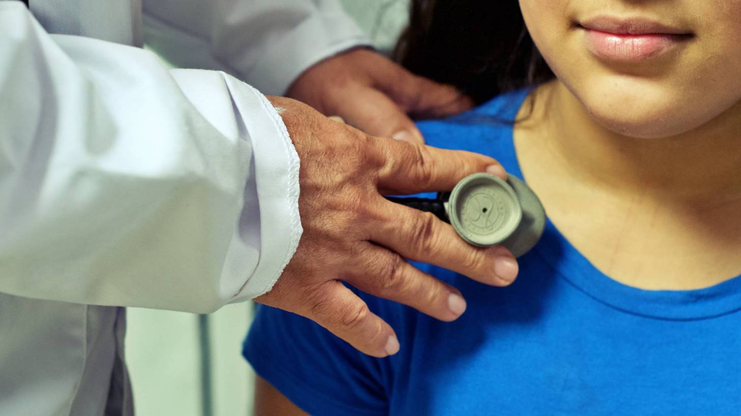 pediatrician with young girl