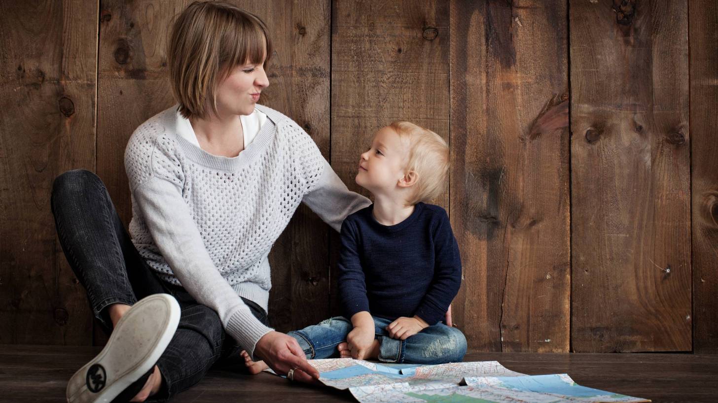 mother and child looking at a map