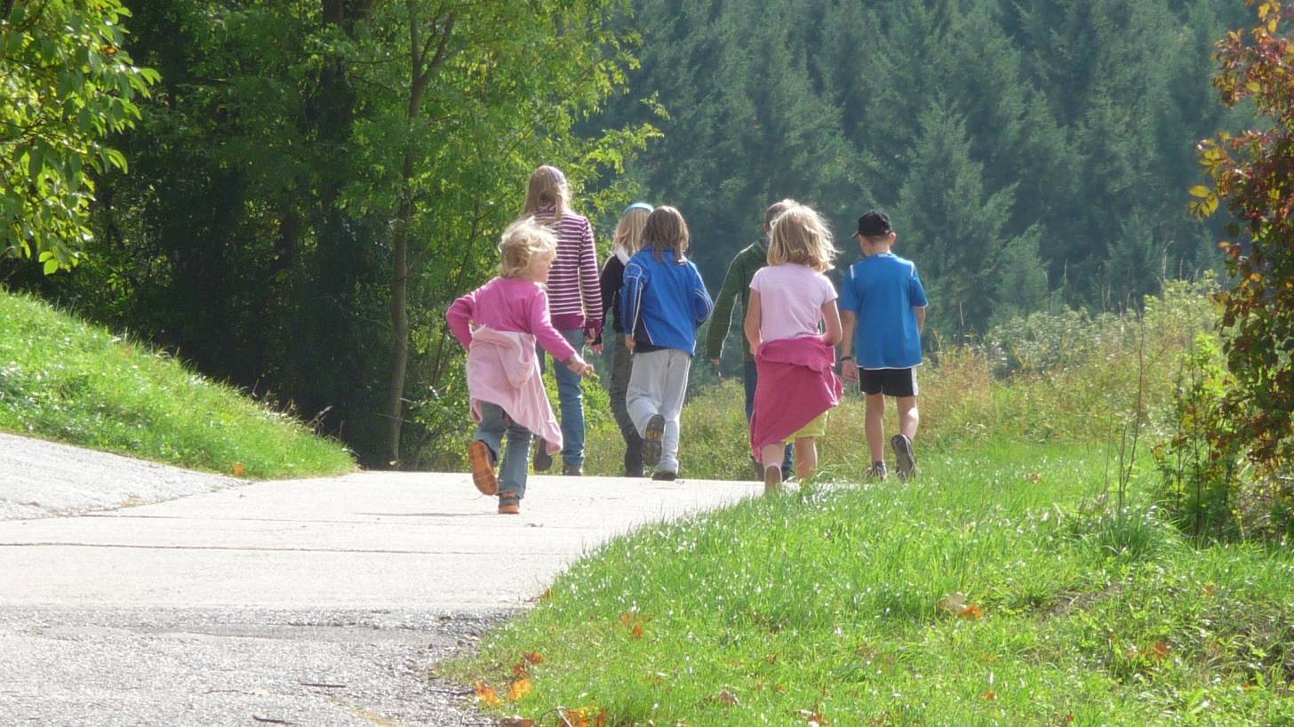 family walking down a road