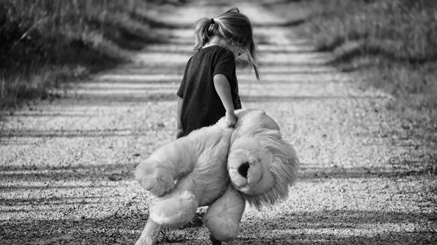 girl walkng teddy bear