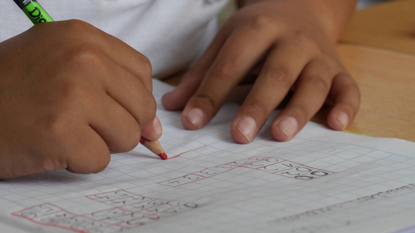 student working at his desk