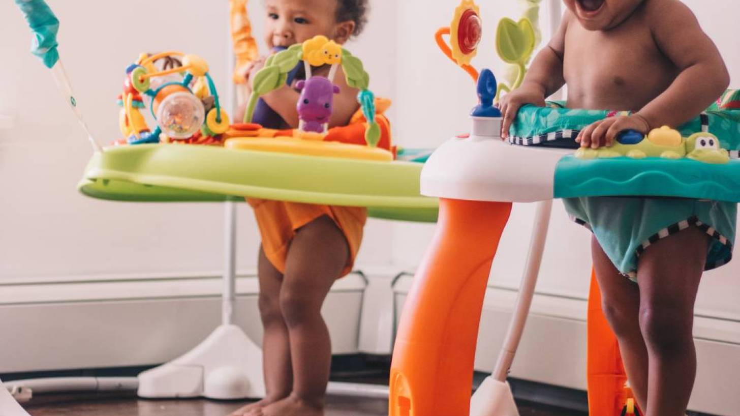 young children in bouncy seats