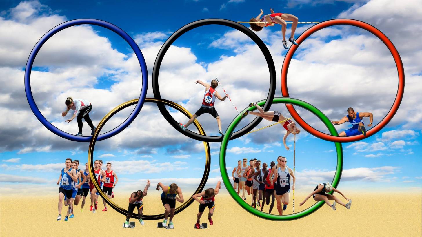 olympic rings and athletes