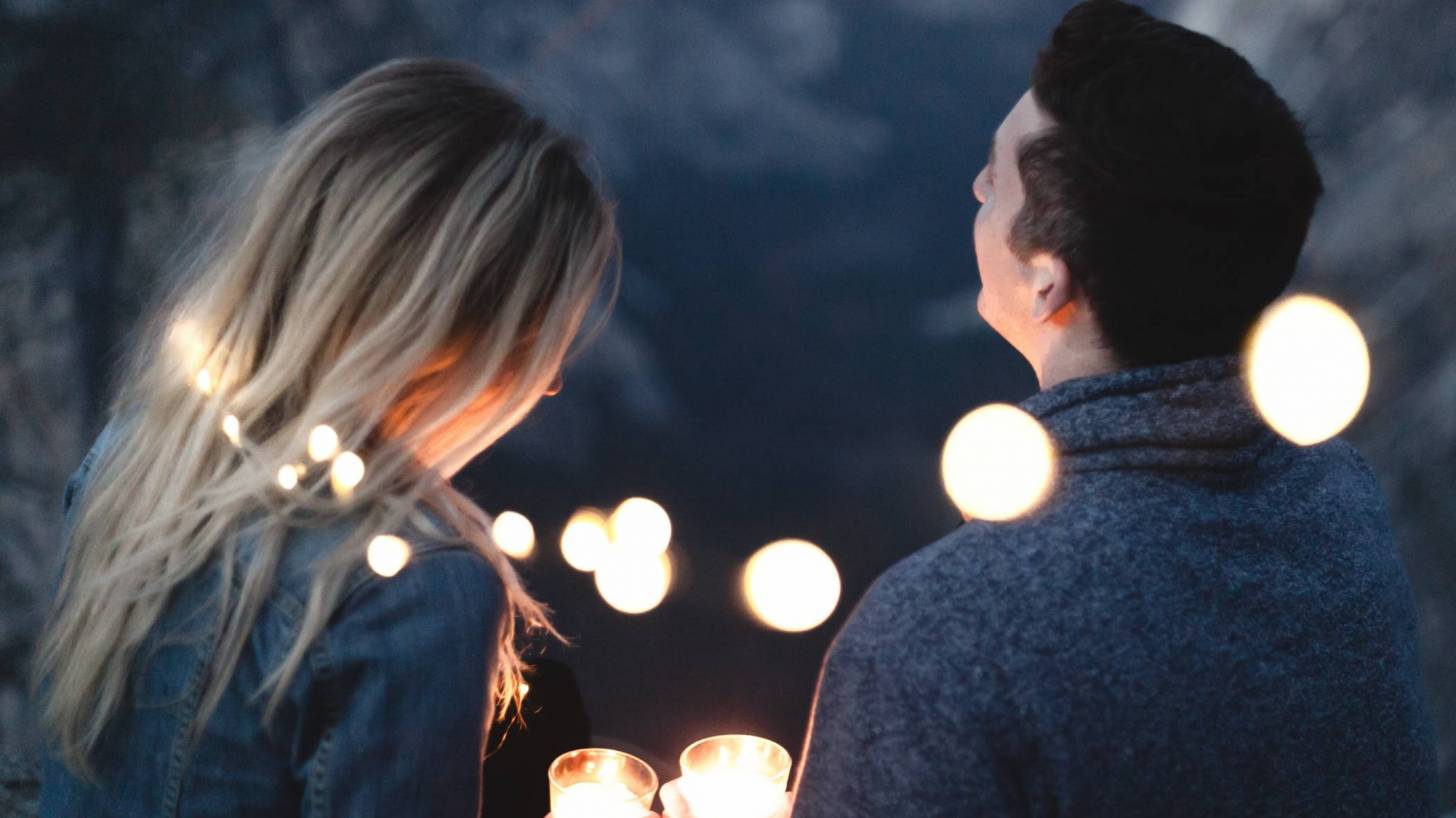 couple in lights at night