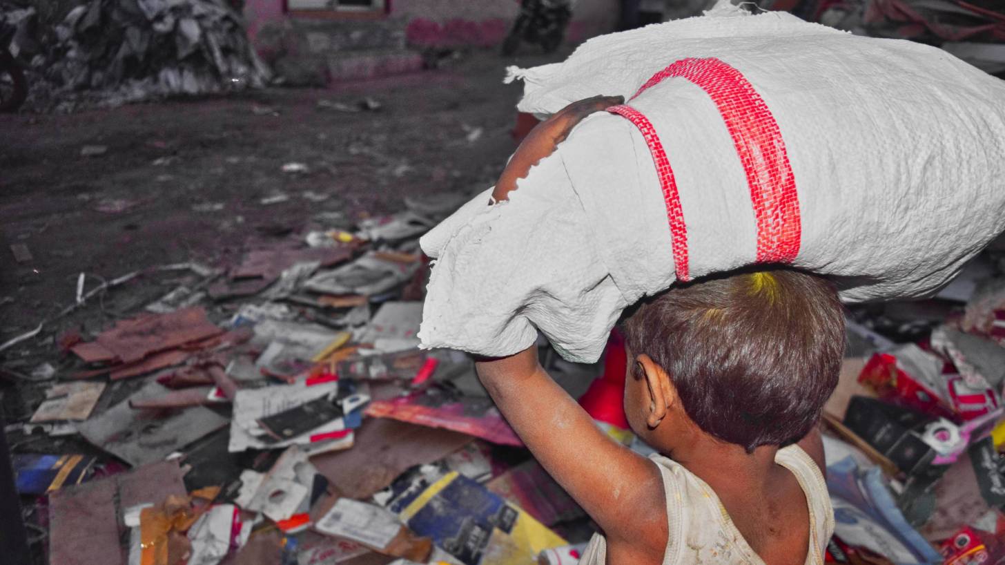 young child working in the slums