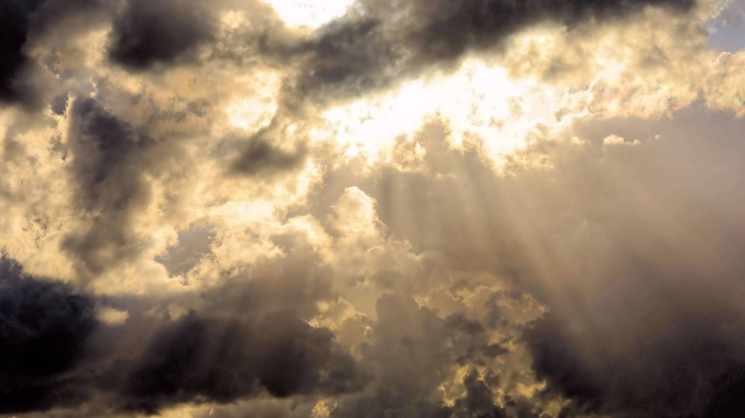 sun spotlighting through clouds