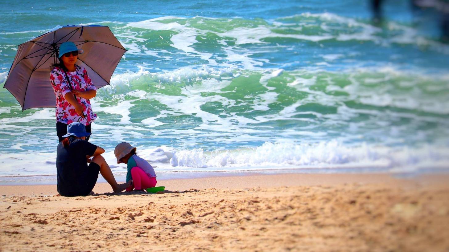 sunny day on the beach protected by the sun