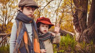 brothers in an autumn park