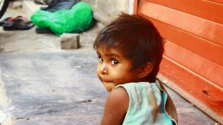 young cute child in the street of India