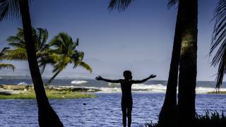 young boy looking over the water