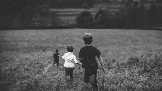 boys running in a field