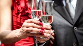 couple celebrating with champagne flutes