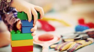 child paying with legos at school