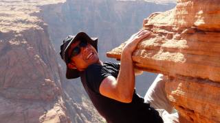 rock climber hanging on by finger nails