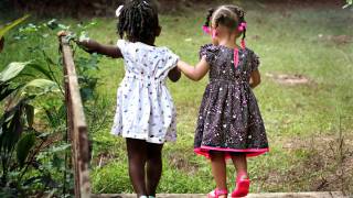 young girls holding hands