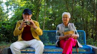 grandparents sitting on a bench