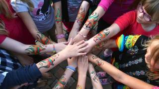 children holding helping hands