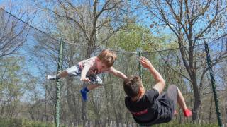 kids jumping on a trampoline