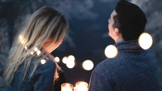 couple in lights at night