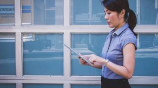 business woman working on pad