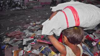 young child working in the slums