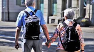 seniors taking a walk hand in hand