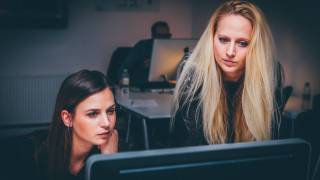 women working on a project together